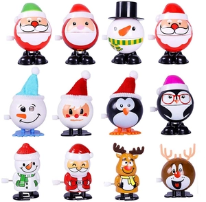 Set of 12 festive Christmas clockwork toys featuring Santa, penguin, and reindeer