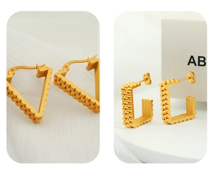 Detailed macro view of gold geometric triangle and rectangle earrings with wavy texture