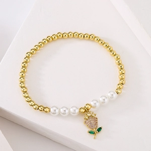 18K gold plated beaded bracelet with white pearls and a crystal flower charm