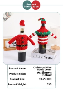 Close-up of knit Christmas wine bottle covers with belt and bell details on table