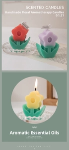 Close-up of small flower shaped scented candles with green leaf base and mini labels