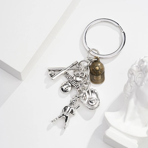 Detailed view of metal baseball keychain with mini glove, bat and sports charms