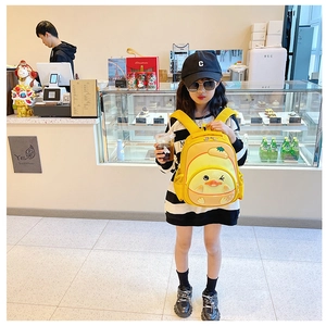 Detail of cute yellow 3D duck backpack for kids with vivid cartoon wink and mesh side pocket