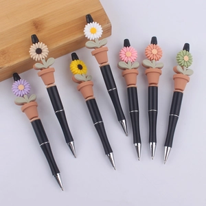 Set of 7 DIY creative pens with colorful silicone sunflower pots on black barrels
