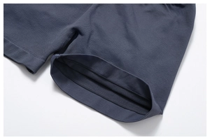 Detailed close-up of seamless stitching and breathable knit fabric on yoga shorts