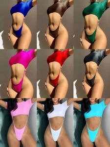 Detail grid of nine colors of cutout one-piece swimsuits with metal ring accents