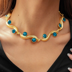 Vintage gold wavy necklace with round blue crystals, luxurious retro royal style for women