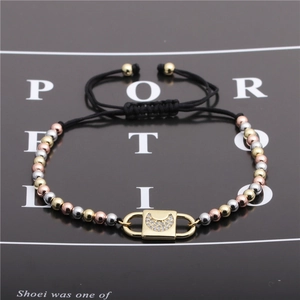 Three-tone metal beads bracelet with a gold moon zircon lock pendant and black cord