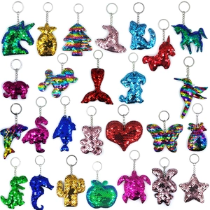 Detailed grid of diverse flip-sequin animal keychains in vibrant metallic colors