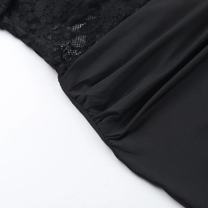 Detailed close-up of intricate black lace stitching and elastic fabric patchwork