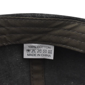 Macro shot of 100% cotton washed baseball cap interior label and fine stitching detail