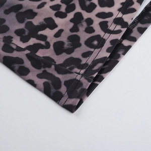 Close-up of leopard print fabric detail showing professional double-needle stitching quality