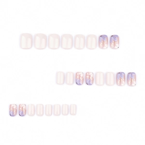 Short square press-on nails with sweet purple floral patterns and gold foil accents