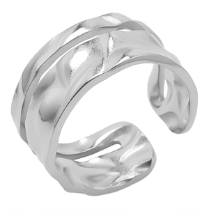 Macro detail of silver irregular hammered texture on adjustable stainless steel ring