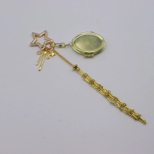 Golden mesh bag charm with star carabiner bow and tassel for lipstick or hand cream