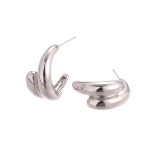 Minimalist silver-colored chunky C-shaped hoop earrings with a polished metallic finish