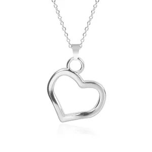 Detailed close-up of a silver heart pendant necklace with a polished metallic finish