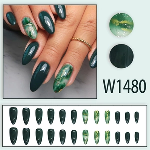 Long almond press-on nails featuring dark emerald green and gold foil marble patterns