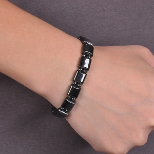 Macro shot of polished wide magnetic hematite bracelet featuring sleek rectangular beads