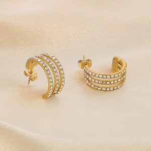 Chic gold-plated C-shaped hoop earrings with three rows of sparkling cubic zirconia stones