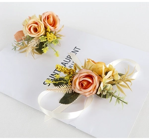 Detailed set of vintage rose boutonniere and wrist corsage for wedding events