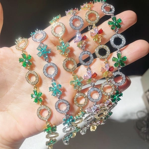 Macro shot of colorful flower zircon bracelets with gold and silver link detailing