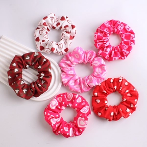 Set of 6 pink and red scrunchies with heart and lip patterns for Valentine decoration
