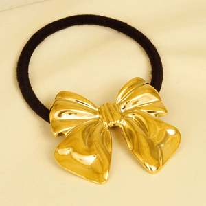 Detail of 304 stainless steel gold bow hair tie with a black elastic band for women