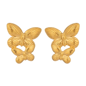 Macro view of 18K gold plated butterfly earrings with intricate textured details