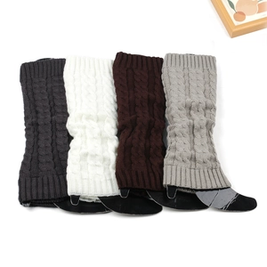 Thick knit leg warmers in cable pattern with grey, white and brown colors