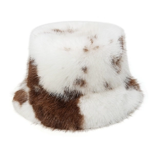 Detailed view of the soft faux fur texture on the brown and white cow print bucket hat