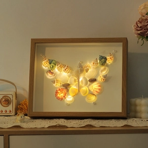 Handmade shell butterfly night light in natural wooden frame with warm LED glow