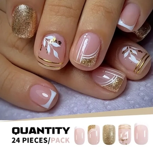 Detail of short square press-on nails with white French tips and golden glitter accents