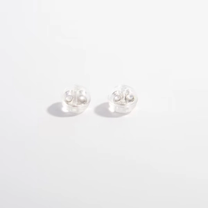 Pair of clear silicone S925 sterling silver earring backs on a clean white background