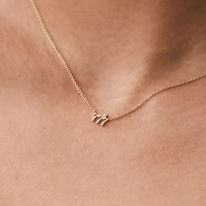 Macro shot of 925 sterling silver angel number 777 pendant necklace with pavé diamonds