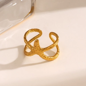 Adjustable golden stainless steel starfish ring with hammered texture for beach vacations