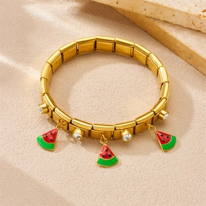 Golden stainless steel elastic bracelet with watermelon enamel charms and clear crystals