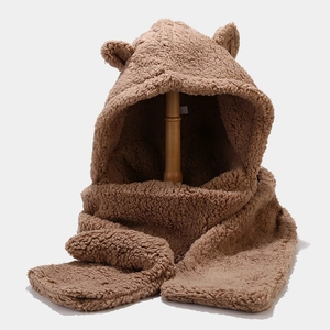 Detailed view of brown plush bear ear hood set with thick faux fur texture and long scarf