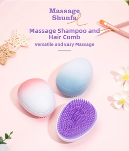 Detail of egg-shaped gradient detangling hairbrushes on a pink aesthetic background