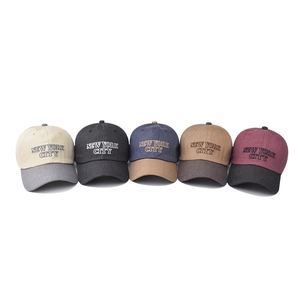 Five assorted New York City embroidered cotton baseball caps in various contrast colors