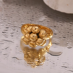 Macro shot of 18K gold plated balloon bubble ring with polished and matte textures