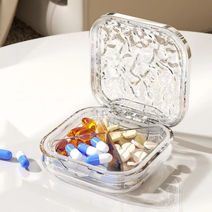 Portable square pill box with water ripple lid and four compartments for medicine storage
