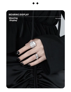 Close-up of layered S925 silver rings with rose motif and sparkling zircon stones