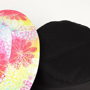 Close-up of cotton twill bucket hat showing floral print and classic black fabric detail