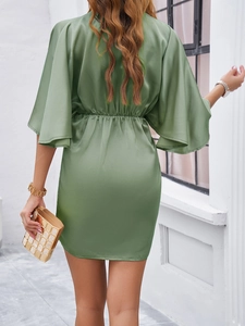 Back view of elegant green satin mini dress with slim waist design and short sleeves