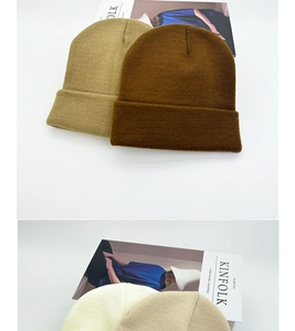 Close-up of soft knitted texture and ribbed cuff design on multi-color beanies