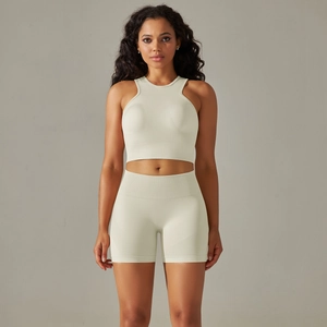 Detailed texture of seamless knit cream white sports bra and high waist biker shorts set