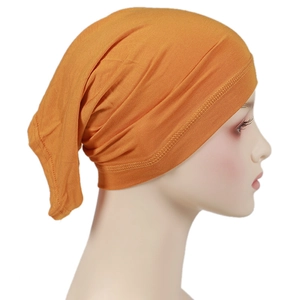 Detailed side view of mustard yellow modal hijab cap showing stitching and elastic fabric