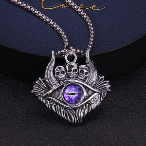 Vintage Turkish evil eye necklace featuring a skull pendant with purple stone on bead chain