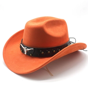 Detail of western cowboy hat featuring a silver bull head metal emblem and rivets